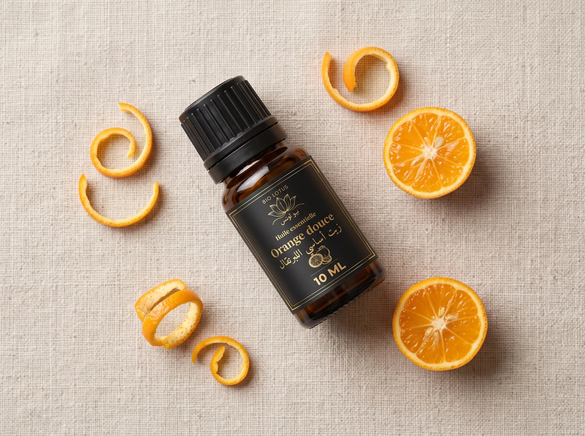 Huile essentielle d'orange douce Bio Lotus entourée d'écorces d'orange fraîches